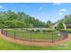 Outdoor community pool with ample chairs and clubhouse for residents to gather at 8505 Loxton Cir, Charlotte, NC 28214