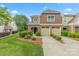 Beautiful two-story townhome with a two-car garage and landscaped front yard at 8505 Loxton Cir, Charlotte, NC 28214
