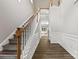 Inviting foyer with hardwood floors, staircase, and wainscoting, creating an elegant entrance at 8505 Loxton Cir, Charlotte, NC 28214