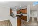 Well-lit kitchen featuring granite countertops, wood cabinets, and modern appliances at 8505 Loxton Cir, Charlotte, NC 28214