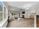 Bright living room featuring a fireplace, high ceilings, hardwood floors, and a neutral color palette at 8505 Loxton Cir, Charlotte, NC 28214