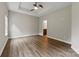 Main bedroom boasts tray ceiling, ceiling fan and ensuite bathroom at 8505 Loxton Cir, Charlotte, NC 28214