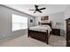 Cozy bedroom featuring a ceiling fan, a window with blinds, and a wood bed at 8938 Kestral Ridge Dr, Charlotte, NC 28269