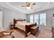 Relaxing bedroom with trey ceiling, ceiling fan, and abundant natural light at 8938 Kestral Ridge Dr, Charlotte, NC 28269