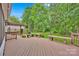 Spacious wooden deck area with pergola and hot tub for relaxing outdoor entertainment at 8938 Kestral Ridge Dr, Charlotte, NC 28269