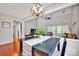 Transitional Dining Room with dark wood floors, decorative lighting fixture, and view to living room at 8938 Kestral Ridge Dr, Charlotte, NC 28269