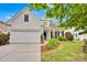 Attractive two-story home with stone accents, well-manicured lawn, and a spacious two-car garage at 8938 Kestral Ridge Dr, Charlotte, NC 28269