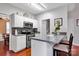Bright and modern kitchen featuring stainless steel appliances, a breakfast bar, and ample cabinet space at 8938 Kestral Ridge Dr, Charlotte, NC 28269