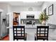 Open kitchen design with stainless steel appliances, breakfast bar, and ample counter space with stylish decor at 8938 Kestral Ridge Dr, Charlotte, NC 28269