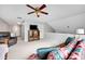 Open-concept living room with couch, bookcase, and ceiling fan at 8938 Kestral Ridge Dr, Charlotte, NC 28269