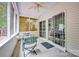 Enclosed porch with ceiling fan and sliding glass doors, perfect for enjoying nature at 8938 Kestral Ridge Dr, Charlotte, NC 28269