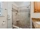 Tiled shower enclosure with bench and window in the bathroom at 9238 Deer Spring Ln, Charlotte, NC 28210