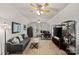 Spacious bonus room featuring a seating area, desk space, and TV, creating a versatile entertainment zone at 9238 Deer Spring Ln, Charlotte, NC 28210