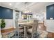 Bright dining room with views into the kitchen, living room and outdoor patio at 9238 Deer Spring Ln, Charlotte, NC 28210