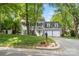 Charming two-story home featuring a well-manicured front yard and a two-car garage at 9238 Deer Spring Ln, Charlotte, NC 28210