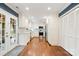 Bright kitchen features stainless appliances, white cabinets, and hardwood floors at 9238 Deer Spring Ln, Charlotte, NC 28210