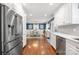 View of the kitchen leading into the dining room with stainless steel appliances at 9238 Deer Spring Ln, Charlotte, NC 28210