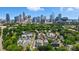 Urban neighborhood with lush trees and a stunning skyline view at 945 Westbrook Dr # A, Charlotte, NC 28202