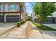 Contemporary home with a private driveway and a well-maintained lawn with lush green landscaping at 945 Westbrook Dr # A, Charlotte, NC 28202