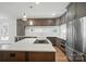 Contemporary kitchen with stainless steel appliances and a central island at 945 Westbrook Dr # A, Charlotte, NC 28202