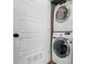 Convenient laundry area with stacked washer and dryer in a closet with a louvered door for ventilation at 945 Westbrook Dr # A, Charlotte, NC 28202