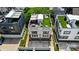 Aerial view of a modern townhouse with a rooftop deck featuring seating and artificial turf at 945 Westbrook Dr # A, Charlotte, NC 28202