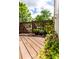Inviting deck with wooden railing featuring flower pots and partial view of yard at 9532 Cadman Ct, Cornelius, NC 28031
