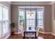 Bright dining area with large windows, hardwood floors, and modern light fixture at 9532 Cadman Ct, Cornelius, NC 28031