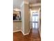 Bright hallway showcases hardwood floors, neutral paint, and access to various rooms at 9532 Cadman Ct, Cornelius, NC 28031
