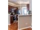 Well-lit kitchen with stainless steel appliances, wood cabinets, and breakfast bar at 9532 Cadman Ct, Cornelius, NC 28031