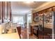 Well-lit kitchen featuring stainless steel appliances, ample wood cabinetry, and an adjacent dining area at 9532 Cadman Ct, Cornelius, NC 28031
