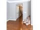 Comfortable room featuring hardwood floors and a charming teddy bear in the corner at 9532 Cadman Ct, Cornelius, NC 28031