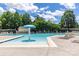 This community pool has lots of lounge chairs and a splash umbrella for  at 9532 Cadman Ct, Cornelius, NC 28031