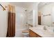 Bathroom with single sink vanity, toilet and shower-tub combination at 10016 Lawing School Rd, Charlotte, NC 28214