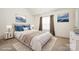 Stylishly staged bedroom featuring a well-made bed, decor and wall art at 10016 Lawing School Rd, Charlotte, NC 28214