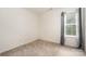 Bedroom featuring neutral carpet, a window, and electrical outlets on the wall at 10016 Lawing School Rd, Charlotte, NC 28214
