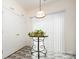 Bright dining area featuring stylish table and chairs, and large window at 10016 Lawing School Rd, Charlotte, NC 28214