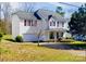 Charming two-story home with a well-maintained lawn and cozy curb appeal at 10016 Lawing School Rd, Charlotte, NC 28214