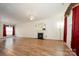Spacious living room with wood flooring, a fireplace, and ample natural light at 10016 Lawing School Rd, Charlotte, NC 28214
