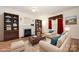 Staged living room features a fireplace, and plenty of seating at 10016 Lawing School Rd, Charlotte, NC 28214