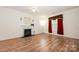 Cozy living room features a classic fireplace, and ample natural light at 10016 Lawing School Rd, Charlotte, NC 28214