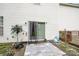 This home's patio area features a sliding glass door with access to the backyard and a wood deck at 10016 Lawing School Rd, Charlotte, NC 28214