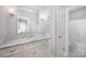 Bright bathroom boasts a marble countertop and a vanity with ample storage at 1010 Nutall Oak Ln, Belmont, NC 28012
