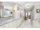 Luxurious bathroom with double vanities, marble countertops, and a soaking tub at 1010 Nutall Oak Ln, Belmont, NC 28012