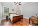 Cozy bedroom with hardwood floors and a warm, inviting atmosphere at 1010 Nutall Oak Ln, Belmont, NC 28012