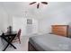 Neutral bedroom features large closet doors, a dresser, and a workspace at 1010 Nutall Oak Ln, Belmont, NC 28012