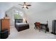 Cozy bedroom with vaulted ceiling, ceiling fan, and a window with a view at 1010 Nutall Oak Ln, Belmont, NC 28012