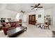 Inviting bonus room features plush carpeting, a leather sofa, and stylish furnishings, perfect for a cozy and versatile living space at 1010 Nutall Oak Ln, Belmont, NC 28012