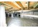 View of the encapsulated crawl space, which includes a moisture barrier on the ground and spray foam insulation on the walls at 1010 Nutall Oak Ln, Belmont, NC 28012