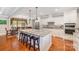 Well-appointed kitchen featuring an island with barstool seating and modern appliances at 1010 Nutall Oak Ln, Belmont, NC 28012
